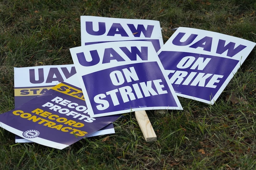 United Auto Workers signs for a strike are shown at the Stellantis Sterling Heights Assembly Plant, in Sterling Heights, Mich., Monday, Oct. 23, 2023. (AP Photo/Paul Sancya, File)