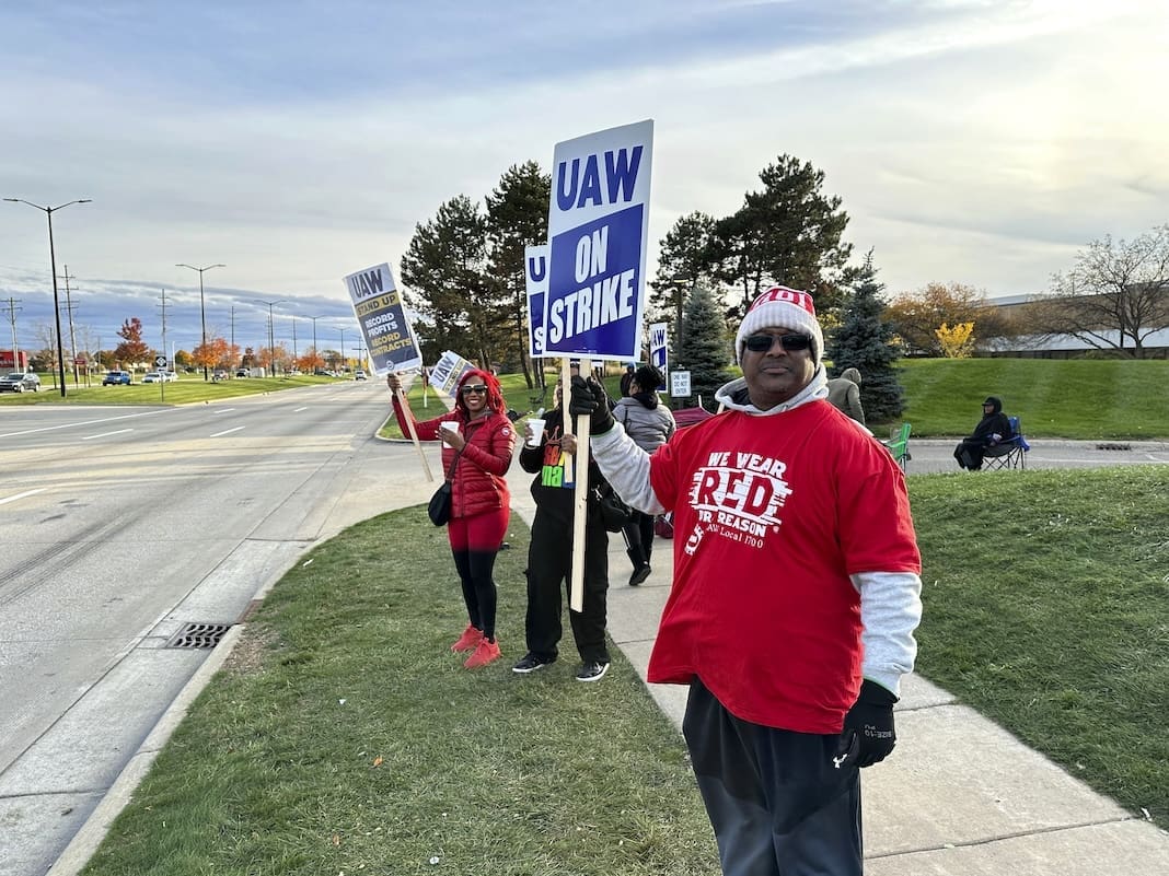 Anthony Collier, 54, and other striking United Auto Workers members picket Saturday, Oct. 28, 2023, outside the Stellantis Sterling Heights Assembly plant in Mich. (AP Photo/Corey Williams)