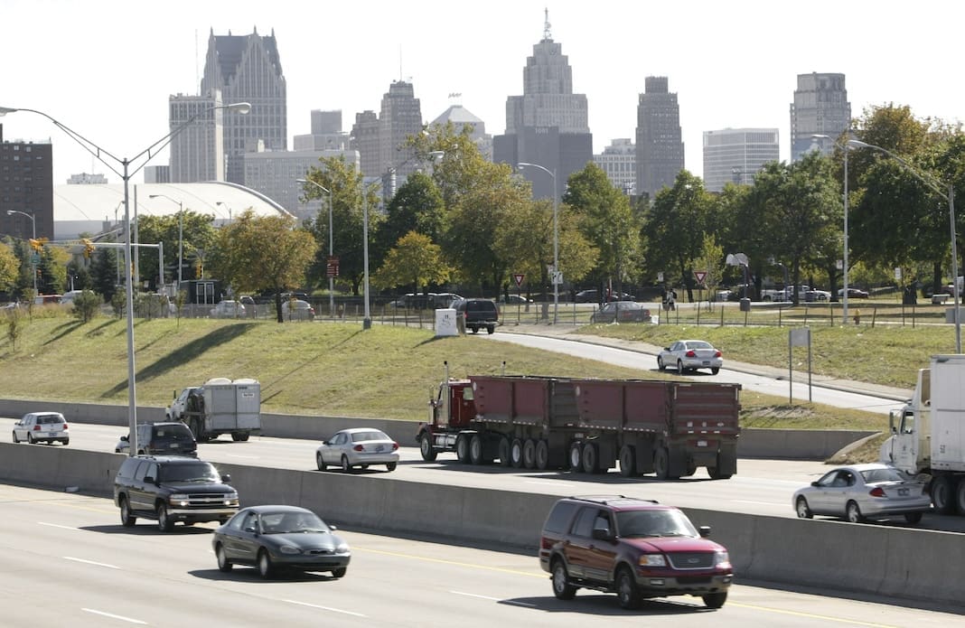 Traffic flows along Interstate 375 near downtown Detroit, on Sept. 30, 2004. A long-delayed plan to dismantle Interstate 375, a 1-mile (1.6-kilometer) depressed freeway in Detroit that was built by demolishing Black neighborhoods 60 years ago, was a big winner of federal money Thursday, Sept. 15, 2022, the first Biden administration grant awarded to tear down a racially divisive roadway. (AP Photo/Paul Sancya, File)