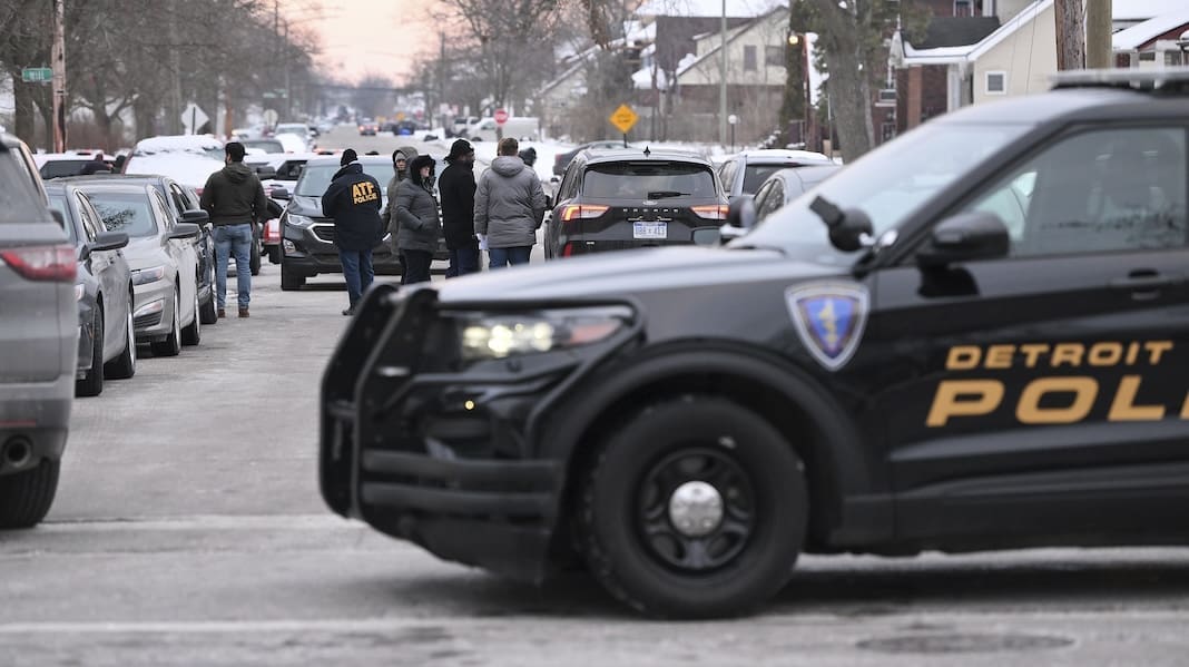 Detroit Police, Michigan State Police and ATF agents work the scene at West McNichols and Log Cabin in Detroit on the border of Highland Park, Mich. on Thursday, Feb. 2, 2023. (Robin Buckson/Detroit News via AP)
